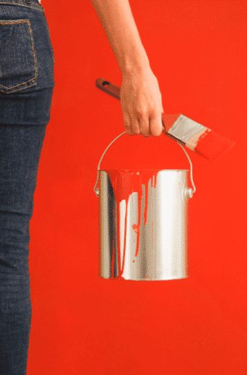 Person Holding Red Paint, Paint Brush, Painted Red Wall